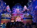 Durga puja celebration with colour full lights and people gathering