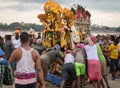 Durga puja - workers push Durga idol to the Ganges river for immersion at Babughat Kolkata.