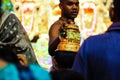 Durgapur, West Bengal, India. July, 2018 A Purohit Panda Blessing a devotee with sacred golden hat at Rath Yatra Festival during N