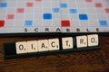 Scrabble board game. Spelling word play, making words out of tiles on square board Royalty Free Stock Photo