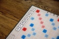 Scrabble board game. Spelling word play, making words out of tiles on square board Royalty Free Stock Photo