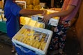 Durian fruit in packages on sale in market, yellow durian in packaging as seasonal fruit of Thailand