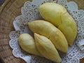 Durian fruit - durian on white paperon bamboo weave tray