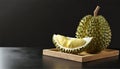 Durian fruit in wooden tray on black background. Durian is king of fruits. AI Generated Royalty Free Stock Photo