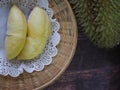 Durian fruit - durian in white paper on bamboo weave tray Royalty Free Stock Photo