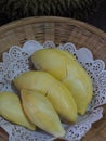 Durian fruit - durian in white paper on bamboo weave tray Royalty Free Stock Photo