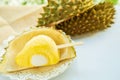 Durian ice cream stick on durian fruit shell on white plate with durian fruit shell blurred blurred background on white table