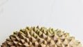 Musang King Durian shell on white marble background.