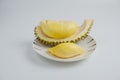 Durian in a plate on a white background and clipping path. Durian is a Thai fruit that is delicious and has a pleasant aroma