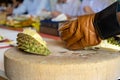 Durian Seller are showing how to open and explain informations and details to audiences about type of durain on the lunch table Royalty Free Stock Photo