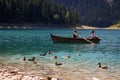 Paradise views of the national park Durmitor in Montenegro. Turquoise water of the lake, pine forest and mountains. Stunning backg Royalty Free Stock Photo