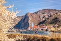 Durnstein village during spring time with tourist ship on Danube river in Wachau, Austria Royalty Free Stock Photo