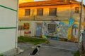 DURRES, ALBANIA: An old building with graffiti drawings on the walls in the center of Durres.