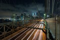 Dusk busy traffic over Brooklyn Bridge with Lower Manhattan Skyline, New York United States Royalty Free Stock Photo