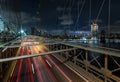 Dusk busy traffic over Brooklyn Bridge with Lower Manhattan Skyline, New York United States Royalty Free Stock Photo