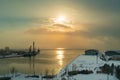 At dusk, Enjoy the serene views of the snow-covered pier snow scene. Royalty Free Stock Photo