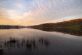 Dusk at Esthwaite Water and reflections of clouds in mackerel sky, Lake District Royalty Free Stock Photo