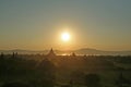 Dusk falls as mist and smoke trails into the sky as sun set seen from the Shwesandaw Pagoda Royalty Free Stock Photo