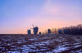 The dusk over the windmills and snowy field, Pyrohiv Skansen, Kyiv, Ukraine