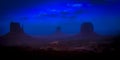 Monument Valley at dusk with iconic West and East Mitten Buttes, Arizona USA Royalty Free Stock Photo