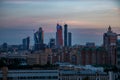Dusk scape of Moscow City in construction on coloured blue and red cloudy sky. Evening after sunset panoramic photo Royalty Free Stock Photo