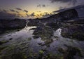 Dusk on scenic rocky beach in Freshwater West, South Wales, UK Royalty Free Stock Photo
