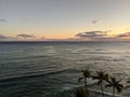 Dusk Serenity: Surfers Embrace the Blue Pacific at Waikiki, Hawaii Royalty Free Stock Photo