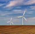 Dusk skies over windmill turbines