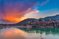 Dusk time at Rishikesh, holy town and travel destination in India. Colorful sky and clouds reflecting over the Ganges River. Royalty Free Stock Photo