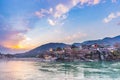 Dusk time at Rishikesh, holy town and travel destination in India. Colorful sky and clouds reflecting over the Ganges River. Royalty Free Stock Photo