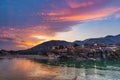 Dusk time at Rishikesh, holy town and travel destination in India. Colorful sky and clouds reflecting over the Ganges River. Royalty Free Stock Photo