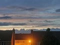 Dusk wall of clouds sunset town streetlight