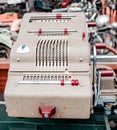 Dusseldorf, Germany Ã¢â¬â Apr 17, 2015: Old calculator Brunsviga for calculating funds in vintage car shop-museum Classic Remise in Royalty Free Stock Photo