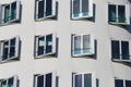 View on white Gehry house facade with futuristic windows facade