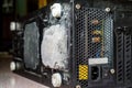 Dust on the computer processor cooler with mainboard and computer case fragment. Selective focus Royalty Free Stock Photo
