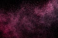 Dust explosion on a black background for graphic resources.