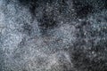 Dust particles cloud generating abstract shape on black background with copy space for text.