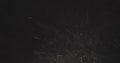 Dust particles fast moving over black background from right Royalty Free Stock Photo