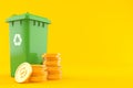 Dustbin with stack of coins Royalty Free Stock Photo