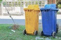 Dustbins in the colors blue, yellow. recycling of large bins