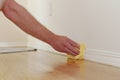 Dusting a Baseboard