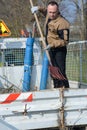 Dustman cleans leaves street