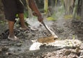 Dustman Clear Weeds From The Lawn Using A Hoe