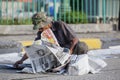 Dustman picks up garbage in the street