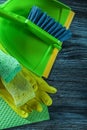 Dustpan broom sponges protective gloves washcloth on wooden boar