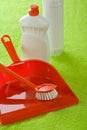 Dustpan brush and bottles Royalty Free Stock Photo