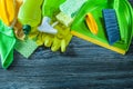 Dustpan brush cleaning objects on vintage wooden board