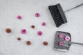 Dustpan, brush and pink flowers on concrete floor Royalty Free Stock Photo