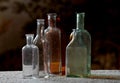 Dusty antique bottles in different colors