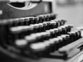 Dusty antique typewriter with focus on the keys in black and white Royalty Free Stock Photo